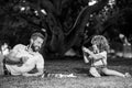 Father and son playing chess outdoor in park. Royalty Free Stock Photo