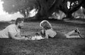 Father and son playing chess spending time together outdoor. Games and entertainment for children. Family concept. Royalty Free Stock Photo