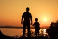 Father and son playing on the coast of lake Royalty Free Stock Photo
