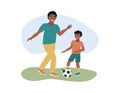 Father and son playing football together. African american dad, boy and soccer ball on grass. Family summer outdoor activities. Royalty Free Stock Photo