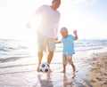 Father son playing football together Concept Royalty Free Stock Photo