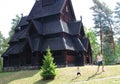 Father and son playing in front of the Gol Church, a stave church originally built in Gol city, but now located in Oslo. Royalty Free Stock Photo