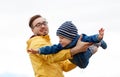 Father with son playing and having fun outdoors Royalty Free Stock Photo