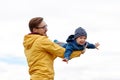 Father with son playing and having fun outdoors Royalty Free Stock Photo