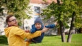 Father with son playing and having fun outdoors Royalty Free Stock Photo