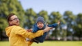 Father with son playing and having fun outdoors Royalty Free Stock Photo