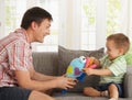 Father and son playing at home Royalty Free Stock Photo