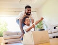 Father, son and playing at home with pretend car in a box on moving day in new property. Black family, house and real Royalty Free Stock Photo