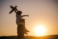 Father and son playing outside. Father and son playing in the park at the sunset time. Childhood memories. Royalty Free Stock Photo