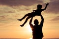 Father and son playing in the park at the sunset time. Royalty Free Stock Photo