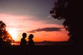 Father and son playing in the park at the sunset time. People having fun on the field. Concept of friendly family and of Royalty Free Stock Photo