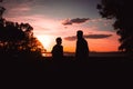 Father and son playing in the park at the sunset time. People having fun on the field. Royalty Free Stock Photo