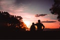 Father and son playing in the park at the sunset time. People having fun on the field. Royalty Free Stock Photo