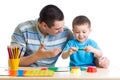 Father and son playing with plasticine Royalty Free Stock Photo