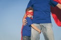 Father and son playing superhero at the day time. Royalty Free Stock Photo