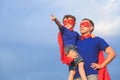 Father and son playing superhero at the day time. Royalty Free Stock Photo