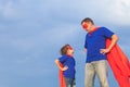 Father and son playing superhero at the day time. Royalty Free Stock Photo