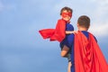 Father and son playing superhero at the day time. Royalty Free Stock Photo