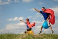 Father and son playing superhero at the day time Royalty Free Stock Photo