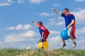 Father and son playing superhero at the day time. Royalty Free Stock Photo