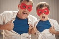 Father and son playing superhero outdoors at the day time. Royalty Free Stock Photo