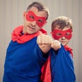 Father and son playing superhero outdoors at the day time. Royalty Free Stock Photo