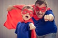 Father and son playing superhero outdoors at the day time. Royalty Free Stock Photo