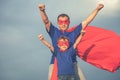 Father and son playing superhero outdoors at the day time. Royalty Free Stock Photo