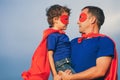 Father and son playing superhero outdoors at the day time. Royalty Free Stock Photo