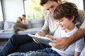 Father and son playing with tablet Royalty Free Stock Photo