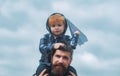 Father and son playing together. Father and son enjoying outdoor. Freedom to Dream - Joyful Boy Playing With Paper Royalty Free Stock Photo