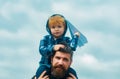 Father and son playing together. Father and son enjoying outdoor. Freedom to Dream - Joyful Boy Playing With Paper Royalty Free Stock Photo