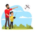 Father and son playing with toy airplane in park Royalty Free Stock Photo