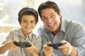 Father And Son Playing Video Game At Home Royalty Free Stock Photo