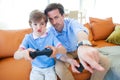 Father and son playing video game Royalty Free Stock Photo