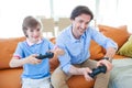 Father and son playing video game Royalty Free Stock Photo