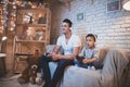 Father and son are playing video games on tv at night at home. Royalty Free Stock Photo