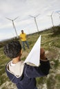 Father And Son Playing At Wind Farm Royalty Free Stock Photo