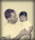 Father and son playng with moustache funny faces Royalty Free Stock Photo