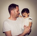 Father and son playng with moustache funny faces Royalty Free Stock Photo