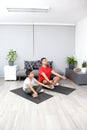 Father and son practice yoga, a mental discipline to improve self-esteem, learn to appreciate their strengths and weaknesses