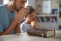 Father with son praying at home Royalty Free Stock Photo