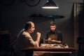 father and son prepare a gift for mother, enthusiastically make shoes in a Shoe shop.