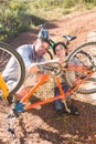 Father and son repairing bike together