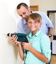 Father and son repairing house Royalty Free Stock Photo