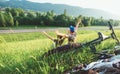 Father and son rest together in green grass when have bicycle walk Royalty Free Stock Photo