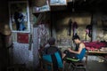 Father and son resting in village house.