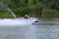 Father and son ride on a jet ski Royalty Free Stock Photo