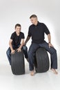 Father and son are riding old tires Royalty Free Stock Photo