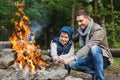 Father and son roasting marshmallow over campfire Royalty Free Stock Photo